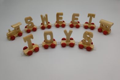 wooden toy train with letters